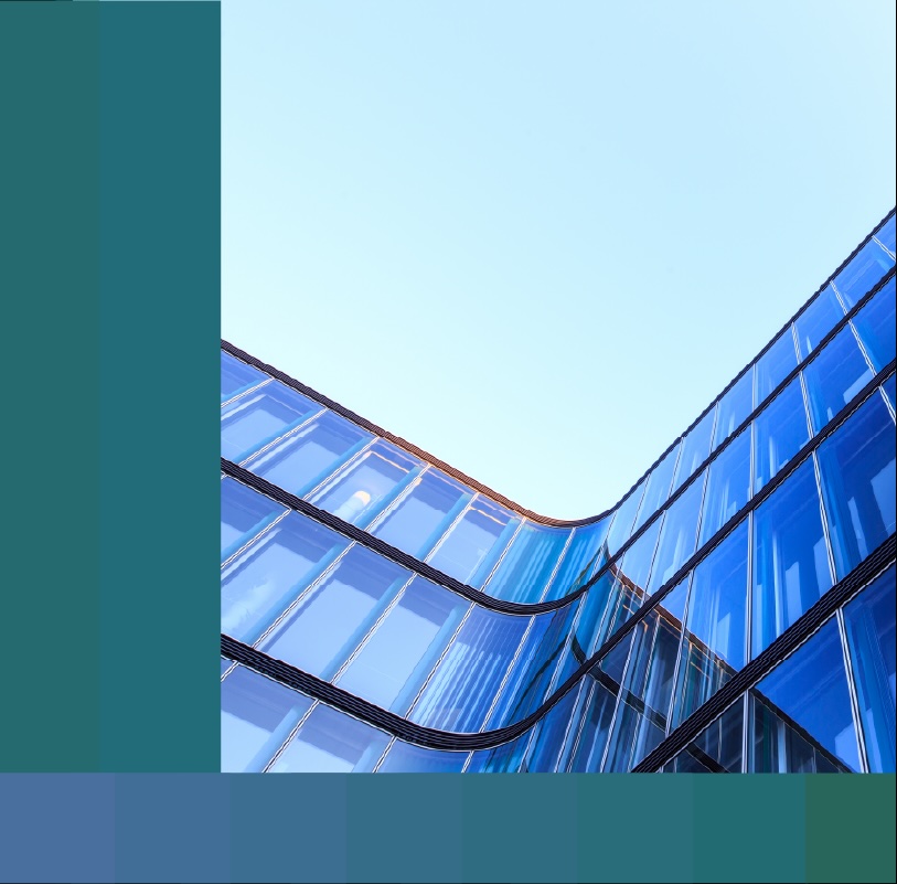Low-angle photo of the curved glass façade of an office building.
